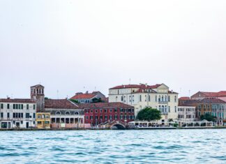 Gondolas floating through the canals of Venice, Italy – The city built on water